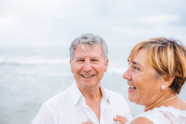 istock Happy senior couple on the beach 1095491500