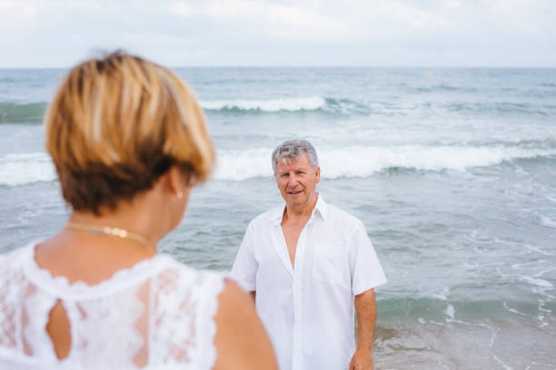 istock Happy senior couple on the beach 1095491524