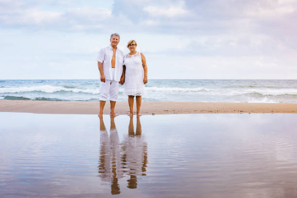 istock Happy senior couple on the beach 1095491604
