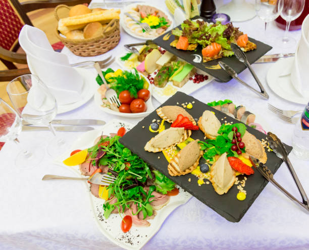istock Various cold appetizers on the buffet: seafood, vegetables, meat, delicacies 1095495706