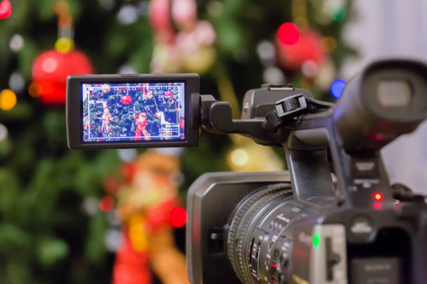 Video shooting at the new year's event. Camcorder with LCD display