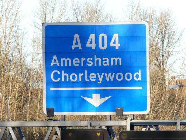 M25 exit sign at Junction 18 for Amersham and Chorleywood A404 This photo was taken in Chorleywood, Hertfordshire, UK. amersham stock pictures, royalty-free photos & images