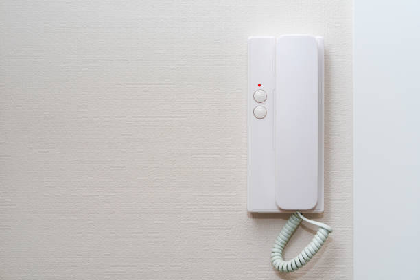 istock Close Up old intercom system in the apartment hanging on the white wall at the door 1095513086