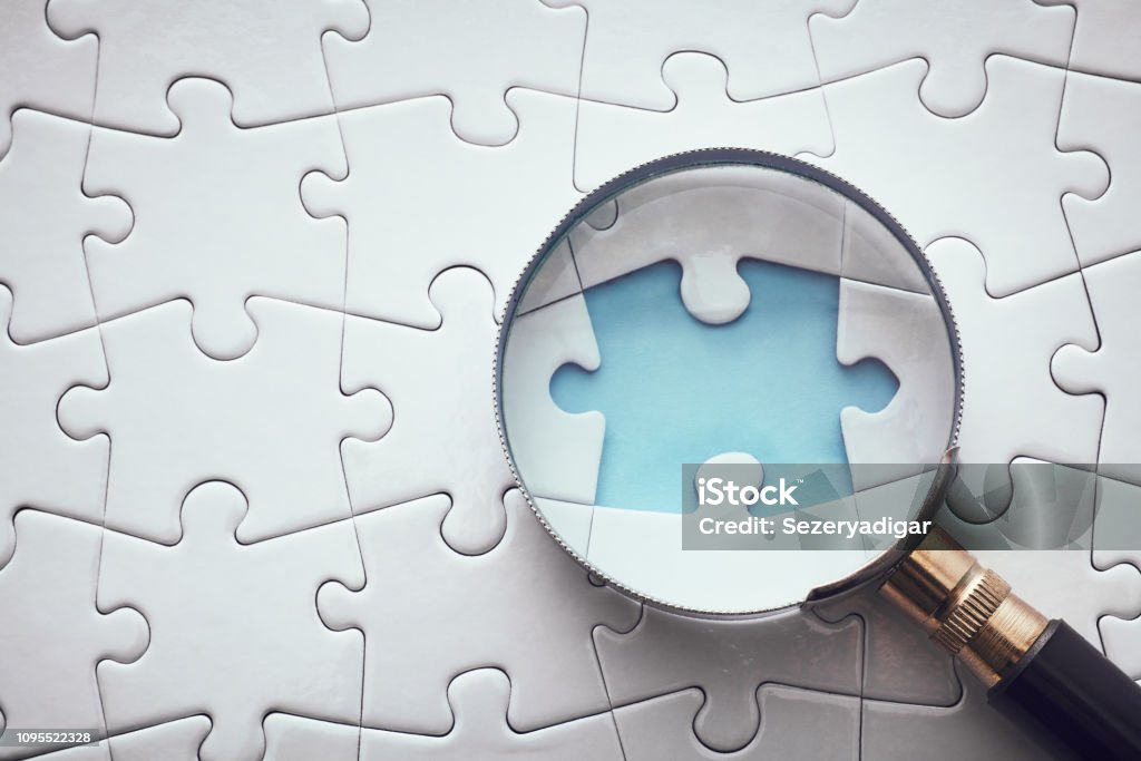 Searching Missing Piece Magnifying Glass Stock Photo