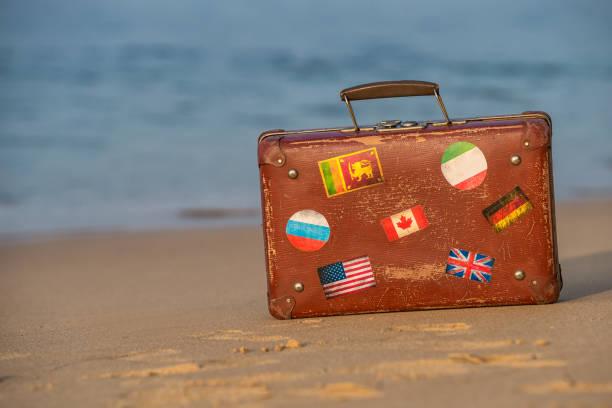 istock Travel  vintage suitcase is alone on a beach 1095527192