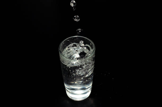 istock liquidity pours into a glass 1095531998