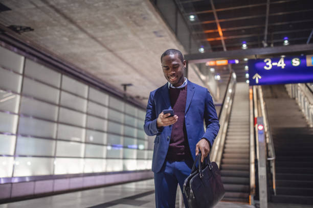 istock Successful young businessman buying tickets for his train online 1095532332