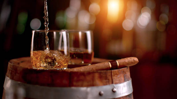 Whiskey drinks placed on wooden keg