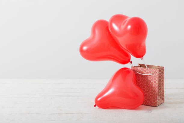 istock heart shaped red balloons on white background 1095534064