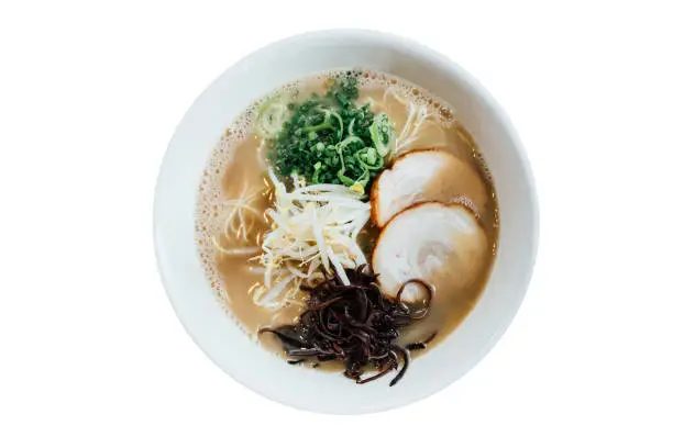 Photo of Isolated Top view of Hakata style Shio Chashumen (Salt soup) including noodle, sliced barbecued pork, sprout, seaweed and scallion.