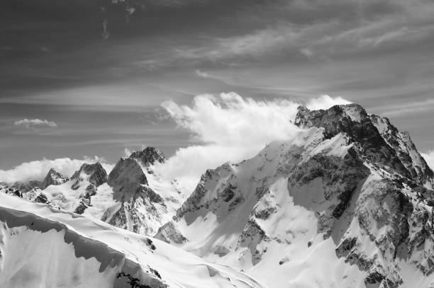 istock Black and white winter mountains with snow cornice 1095538336