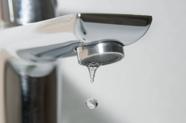 istock Bath faucet and falling water drops close up 1095541526