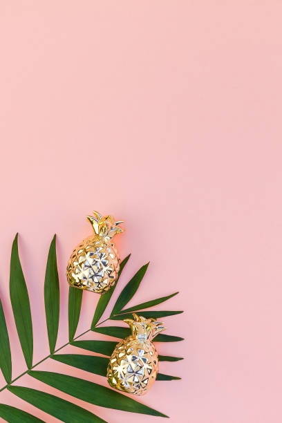 istock Creative pink background with tropical palm leaves 1095551806