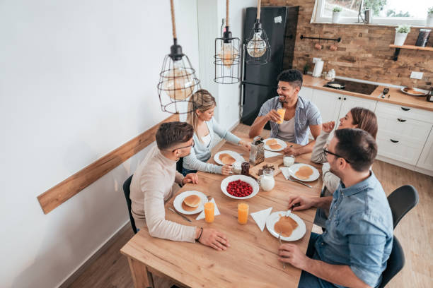 istock Roommates eating pancakes at home. 1095553182