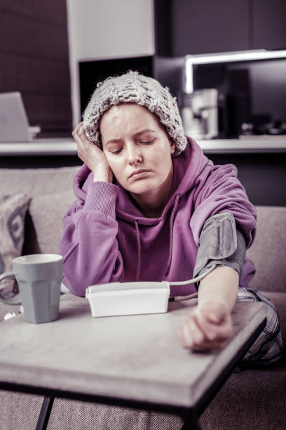 istock Negative delighted woman checking her blood pressure 1095557282
