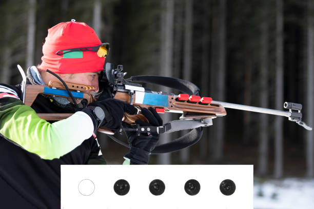 istock Shot of Young Male Biathlon Competitor Practicing Target Shooting 1095558976