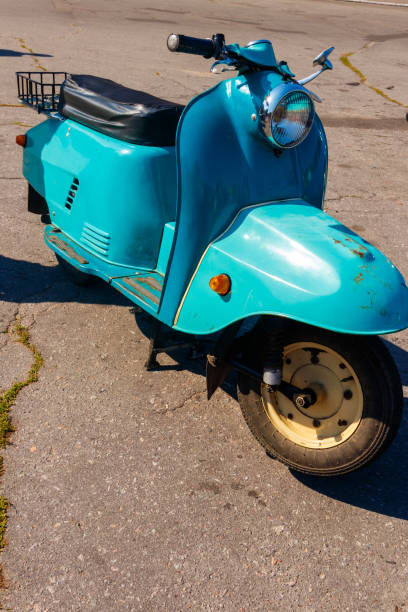 istock Blue retro scooter parked on city street 1095563876