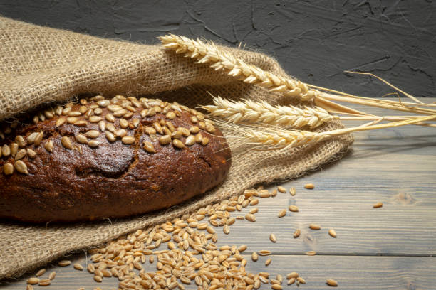 istock Bread with sunflowers on rustic wooden table 1095563958