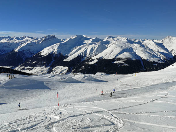 istock Winter holidays between snow-covered Swiss mountains. Davos, Switzerland 1095567098