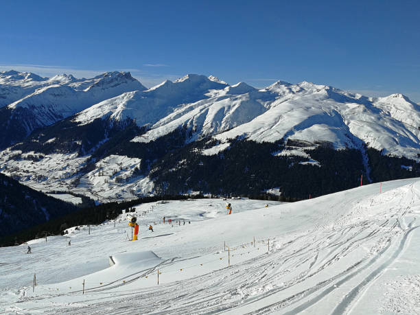 istock Winter holidays between snow-covered Swiss mountains. Davos, Switzerland 1095567190