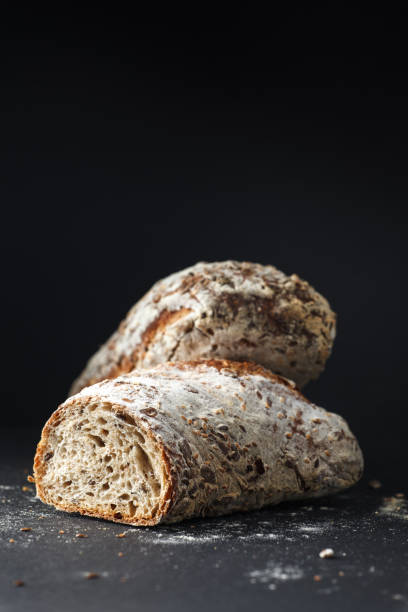 istock Homemade bread loaf on rustic dark background 1095570510