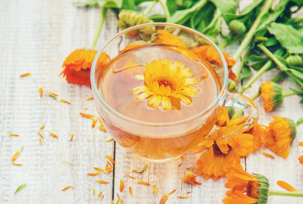 istock calendula tea and flowers. Selective focus. nature. 1095575676