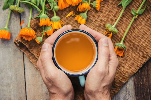 istock calendula tea and flowers. Selective focus. nature. 1095575736