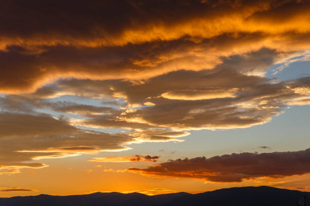 istock Sunset with dark heavy clouds, beautiful landscape 1095579108