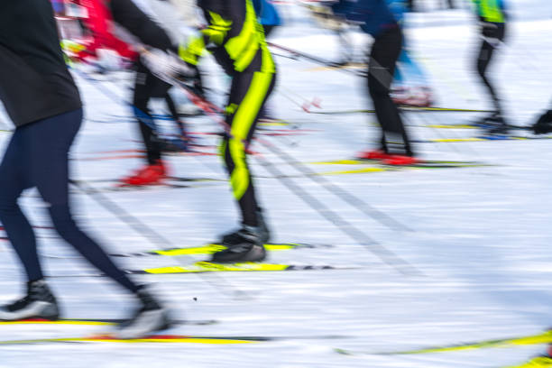 Blurred image of large group of cross country skiers.