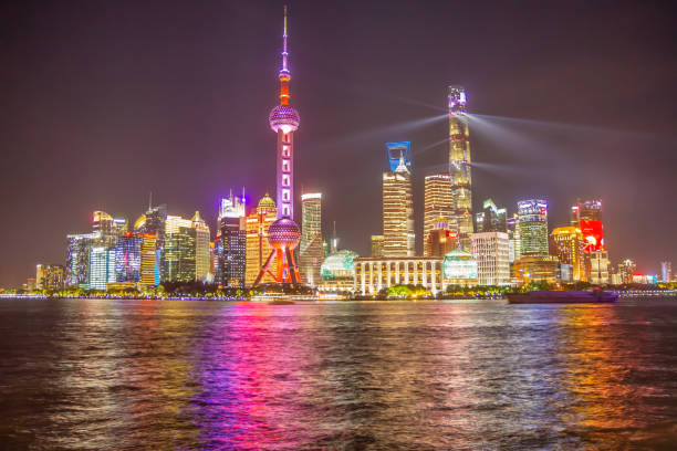 Shanghai, China, skyline at night as seen from the Bund walkway. stock photo