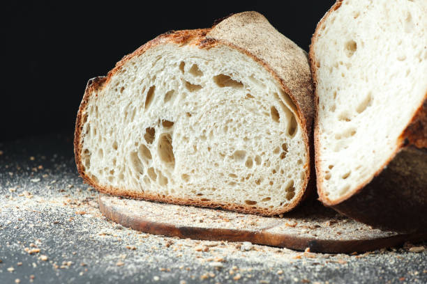 istock Homemade bread loaf on rustic dark background 1095591506