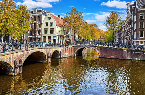 istock Bridge over channel in Amsterdam Netherlands houses river Amstel 1095591890