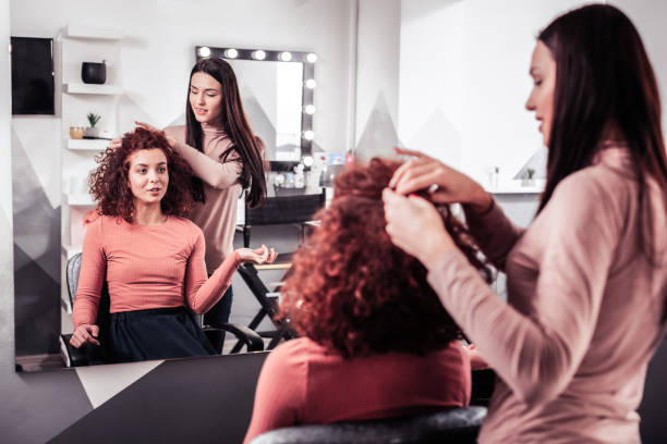 istock Delighted nice woman wanting to have her hair cut 1095594746