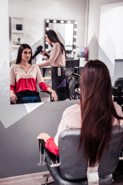 istock Beautiful long haired woman visiting a beauty salon 1095594876