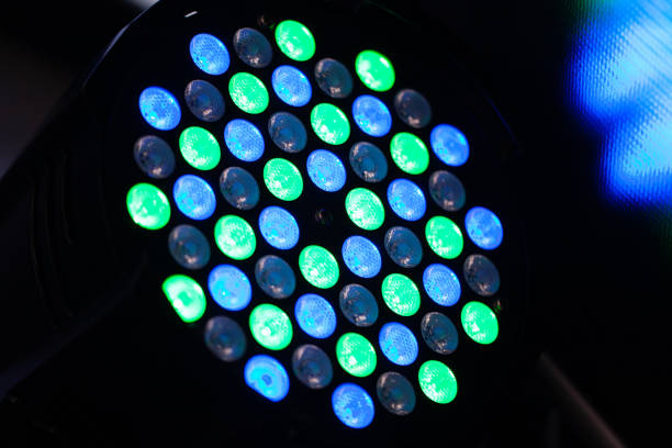 green and blue light emitting diodes lighting disco equipment. professional staff for organization of a celebration or business conference