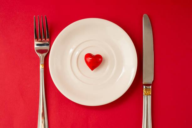 istock Red heart on the white plate for Valentines day. Top view. 1095599404