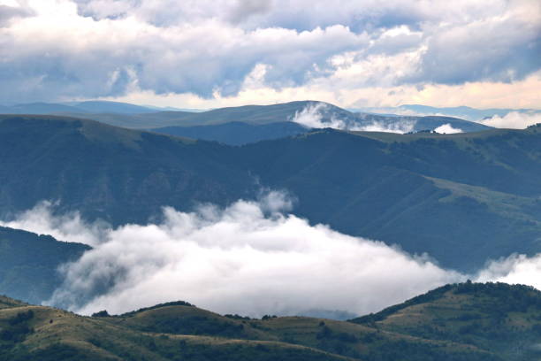 istock Tops of mountains in the clouds 1095603170