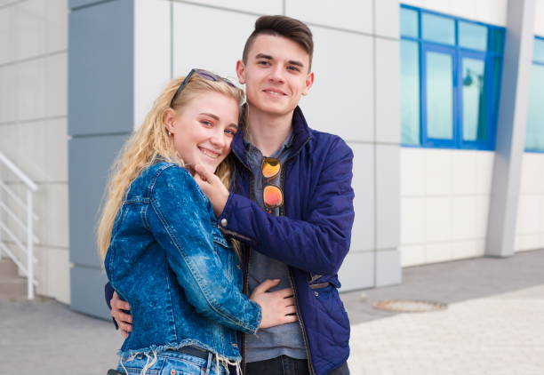 istock Girl and boy, jeans jacket, fun, close up 1095603942