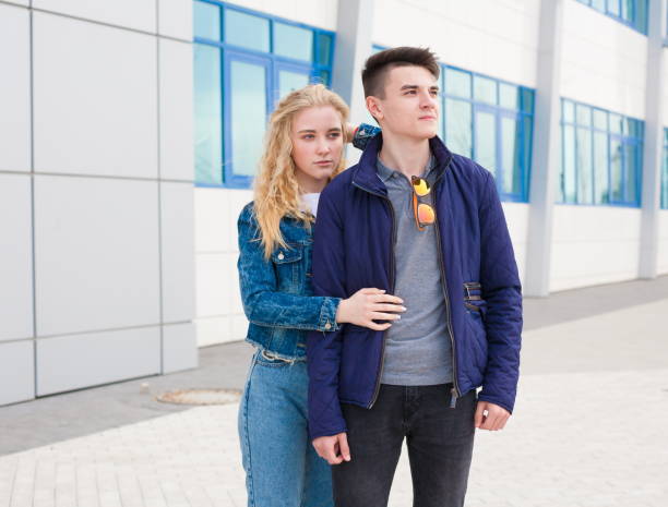 istock Girl and boy, jeans jacket, close up 1095605350