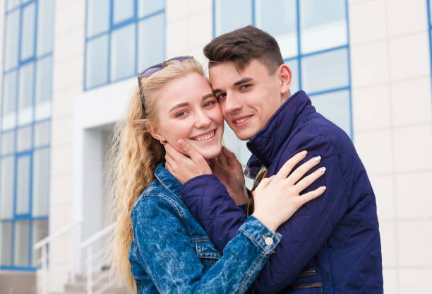 istock Girl and boy, jeans jacket, fun, close up 1095605452