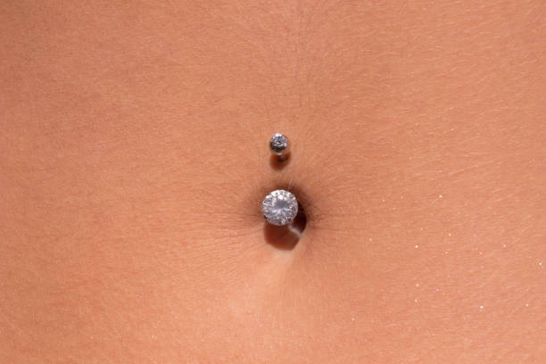 istock Belly piercing in the navel close up 1095606148
