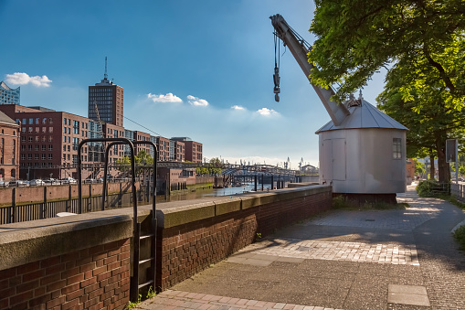 Old harbor crane on the edge of Hamburg's Speicherstadt on the Zollkanal