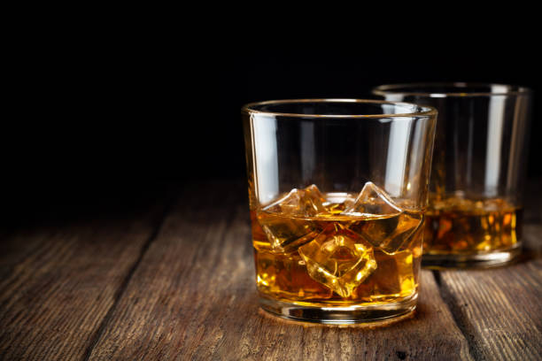 istock Two glass of whiskey with ice 1095608490