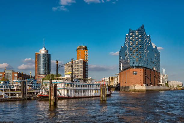 View of Hamburg's Hafencity with Elbphilharmonie Sunny day in the port of Hamburg with some architectural buildings in the Hafencity elbphilharmonie photos stock pictures, royalty-free photos & images
