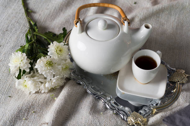 Teapot with a small mug.