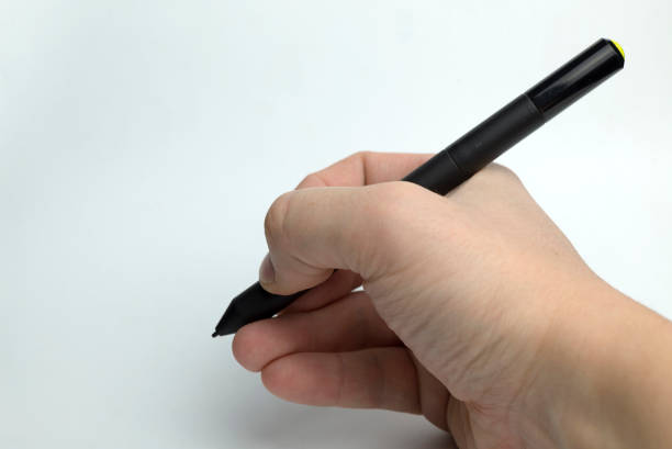 istock Hand on a white background holding a pencil. 1095609668