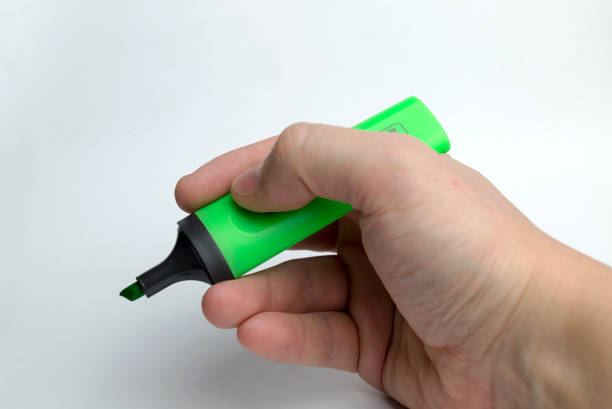 istock Hand on a white background holding marker. 1095610842