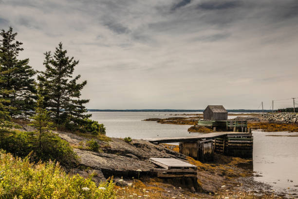 istock Fishing Hut by the Sea in Blue Rocks 1095615140
