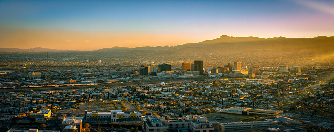 A panoramic photo of sunset on the US-Mexico border in El Paso, Texas.