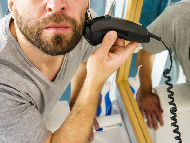 istock Man shaving trimming his beard 1095634372